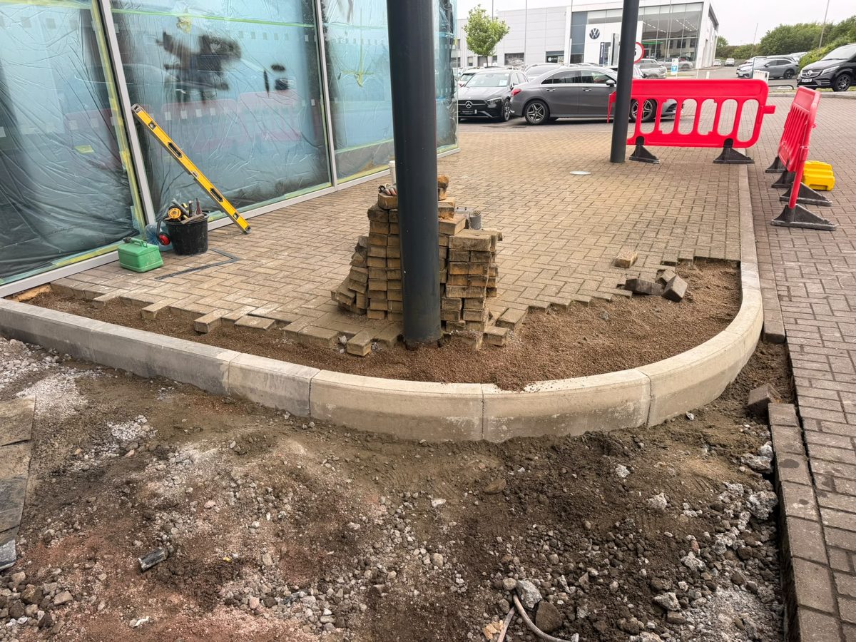 Kerbing, paving and concrete works to a commercial building frontage