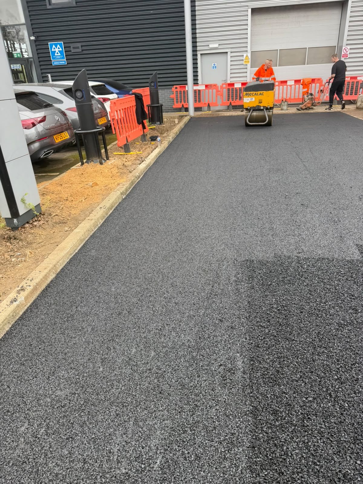 Tarmac surfacing to a commercial car park and access road
